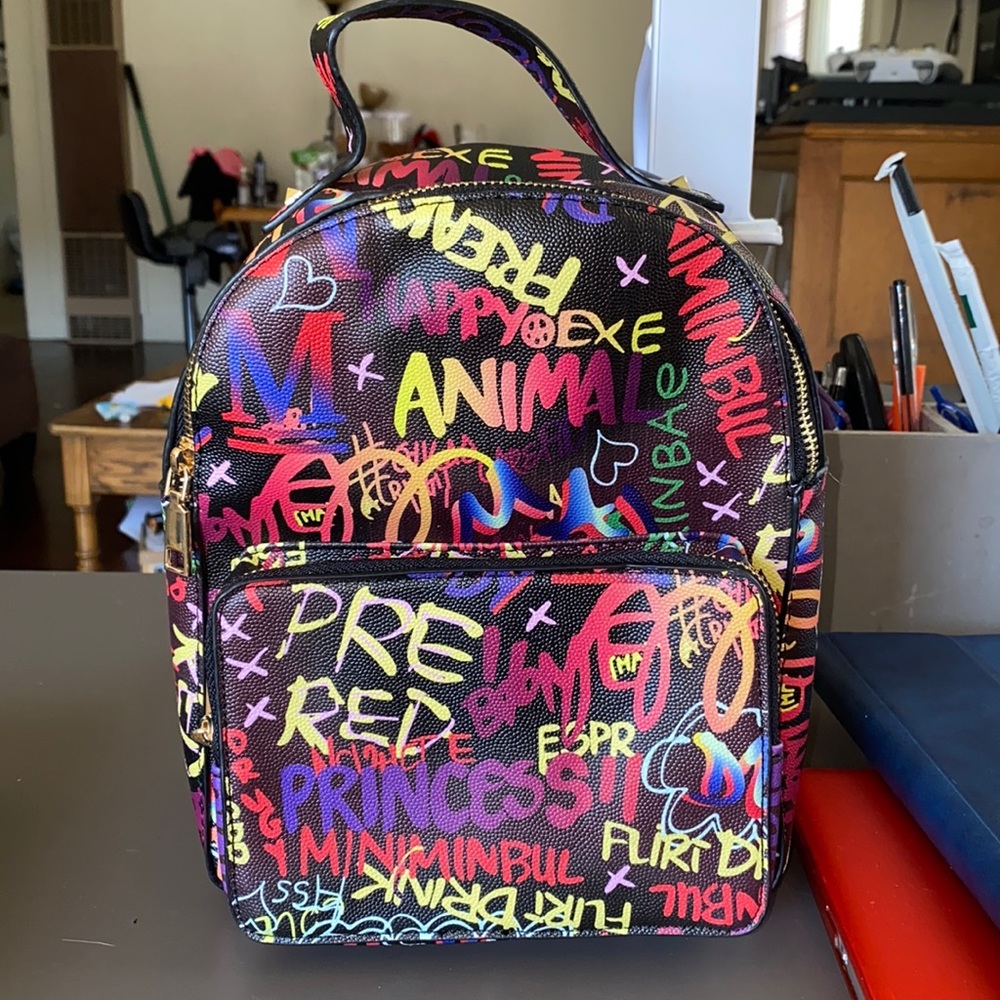 Graffiti back pack purse.